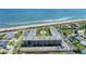Stunning aerial perspective of Ormond Breakers Condominium complex, pool, and beachfront at 2100 Ocean Shore Blvd # 1120, Ormond Beach, FL 32176