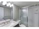 Bathroom features granite countertop, modern sink, and a glass door shower at 2100 Ocean Shore Blvd # 1120, Ormond Beach, FL 32176