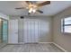 Bedroom with ceiling fan, window, and large closet at 2100 Ocean Shore Blvd # 1120, Ormond Beach, FL 32176