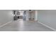 Open-concept living room view to the kitchen with grey cabinets and modern design at 2100 Ocean Shore Blvd # 1120, Ormond Beach, FL 32176