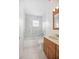 Bathroom featuring updated tile shower, modern fixtures, and a vanity with storage at 2126 Sabal Palm Dr, Edgewater, FL 32141