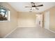 Spacious bedroom with tile flooring, ceiling fan, and ample natural light from a window at 2126 Sabal Palm Dr, Edgewater, FL 32141