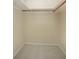 Walk-in closet featuring tile floors and minimal storage at 2126 Sabal Palm Dr, Edgewater, FL 32141