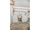 Inside the garage is the laundry area featuring a washer, dryer and utility sink at 2126 Sabal Palm Dr, Edgewater, FL 32141