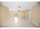 Spacious living area with tile floors, neutral walls, and recessed lighting at 2126 Sabal Palm Dr, Edgewater, FL 32141