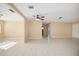 Spacious living area featuring tile floors, neutral walls, and an arched doorway at 2126 Sabal Palm Dr, Edgewater, FL 32141