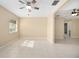 Bright living area featuring tile floors, neutral walls, and a large window at 2126 Sabal Palm Dr, Edgewater, FL 32141