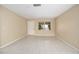 Bright living area featuring tile floors, neutral walls, and a large window at 2126 Sabal Palm Dr, Edgewater, FL 32141