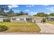 Charming single-story home featuring stone accents, attached garage, and well-maintained front yard at 2144 Brian Ave, South Daytona, FL 32119