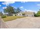 Charming single-story home showcasing a well-manicured lawn and a spacious driveway for convenient parking at 2144 Brian Ave, South Daytona, FL 32119