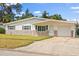 Charming single-story home featuring stone accents, attached garage, and well-maintained lawn at 2144 Brian Ave, South Daytona, FL 32119