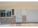 Inviting front entrance with decorative stone detail and well-lit porch at 2144 Brian Ave, South Daytona, FL 32119
