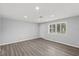 Bright living room with wood floors, recessed lights and plantation shutters at 2144 Brian Ave, South Daytona, FL 32119