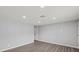 Bright open living room with wood floors, neutral paint and recessed lighting at 2144 Brian Ave, South Daytona, FL 32119