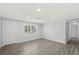 Spacious living room with new wood floors, neutral paint and natural light at 2144 Brian Ave, South Daytona, FL 32119