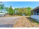 A spacious backyard provides a serene outdoor area and detached storage buildings at 2214 Danforth Ave, Deltona, FL 32738