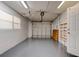 Spacious garage featuring an automatic door opener and a painted floor at 2214 Danforth Ave, Deltona, FL 32738