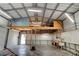 Open garage interior has a loft space and features ample storage with walls for hanging tools at 2214 Danforth Ave, Deltona, FL 32738