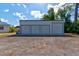 Large detached garage with three bays providing ample storage or workshop space at 2214 Danforth Ave, Deltona, FL 32738