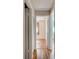 Hallway featuring wood flooring with multiple bedroom doorways visible at 2214 Danforth Ave, Deltona, FL 32738