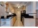 Well-appointed kitchen featuring granite countertops and modern appliances at 2214 Danforth Ave, Deltona, FL 32738