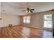 Bright living room featuring wood-look floors and a stylish ceiling fan at 2214 Danforth Ave, Deltona, FL 32738