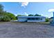 The back of the home has a large yard, a screen room and plenty of extra parking at 2214 Danforth Ave, Deltona, FL 32738