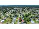 Expansive aerial view of a charming neighborhood with mature trees and glimpses of a tranquil lake nearby at 2254 Green St, South Daytona, FL 32119