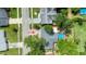 Birds-eye view of home with an inviting backyard featuring a refreshing above-ground pool and lush green trees at 2254 Green St, South Daytona, FL 32119