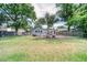 Large backyard with a pool, playset, and ample space for outdoor activities at 2254 Green St, South Daytona, FL 32119