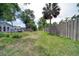 Backyard featuring a grassy lawn with a above-ground pool and mature trees at 2254 Green St, South Daytona, FL 32119