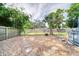 Backyard with a gravel area and above ground pool, surrounded by a wooden fence at 2254 Green St, South Daytona, FL 32119