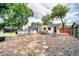 Landscaped backyard featuring a gravel area, patio seating, and above-ground pool at 2254 Green St, South Daytona, FL 32119