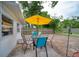 Backyard with outdoor furniture, a yellow umbrella, and lush greenery, perfect for relaxing at 2254 Green St, South Daytona, FL 32119