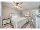 Charming bedroom featuring wood-look floors, a ceiling fan, and ample natural light at 2254 Green St, South Daytona, FL 32119