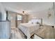 Relaxing bedroom featuring wood-look floors, neutral colors, and ample natural light at 2254 Green St, South Daytona, FL 32119