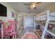 Spacious bedroom with a loft bed, closet, flower rug, and stylish decor at 2254 Green St, South Daytona, FL 32119