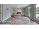 Bright bonus room featuring wood-look flooring, sliding glass doors, and neutral paint at 2254 Green St, South Daytona, FL 32119