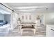 Dining area with a white barn door, modern light fixture, and neutral decor at 2254 Green St, South Daytona, FL 32119