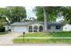 Charming home with a well-maintained lawn and inviting front porch at 2254 Green St, South Daytona, FL 32119