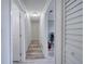 Hallway with multiple doors, closets, and wood-look flooring at 2254 Green St, South Daytona, FL 32119