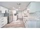 Modern kitchen with stainless steel appliances, marble countertops, and white subway tile backsplash at 2254 Green St, South Daytona, FL 32119
