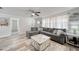 Spacious living room featuring a comfortable gray sofa, stylish coffee table, and light wood floors at 2254 Green St, South Daytona, FL 32119
