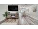 Bright living room with modern flooring, fireplace, and open dining area at 2254 Green St, South Daytona, FL 32119