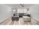 Inviting living room with comfortable gray sofa, stylish coffee table, light wood floors, and ample natural light at 2254 Green St, South Daytona, FL 32119