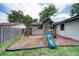 Backyard with a charming playset, perfect for Gathering fun and entertainment at 2254 Green St, South Daytona, FL 32119