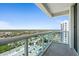 Spacious balcony offering panoramic city and green views with glass railings at 231 Riverside Dr # 2310, Holly Hill, FL 32117