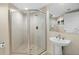 A bathroom with a glass enclosed stand up shower and pedestal sink at 231 Riverside Dr # 2310, Holly Hill, FL 32117