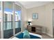 Comfortable bedroom featuring an outdoor balcony overlooking the city's buildings at 231 Riverside Dr # 2310, Holly Hill, FL 32117