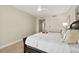 Cozy bedroom featuring neutral tones, carpet, and a ceiling fan creating a peaceful retreat at 231 Riverside Dr # 2310, Holly Hill, FL 32117